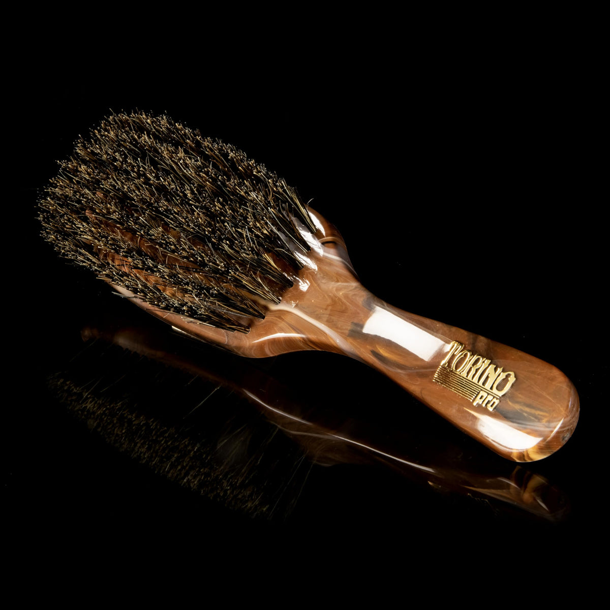 Close-up of black boar bristles on Torino Pro Wave Brush for durable brushing