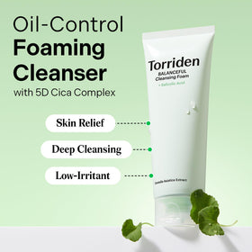 Close-up of Torriden Balanceful foam lather forming between fingers for thorough cleansing.