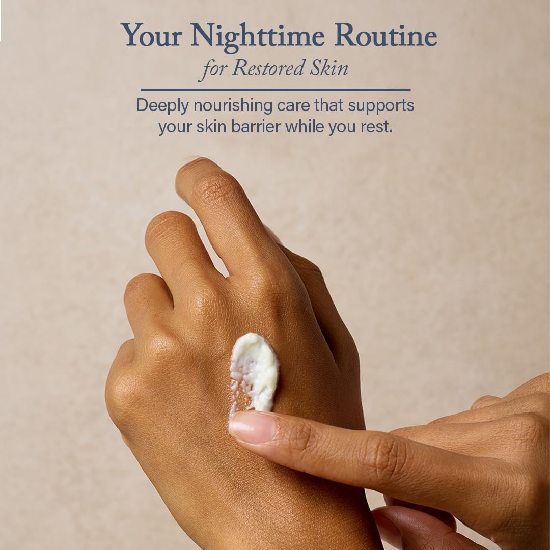 Hands massaging balm into dry, red-prone skin.