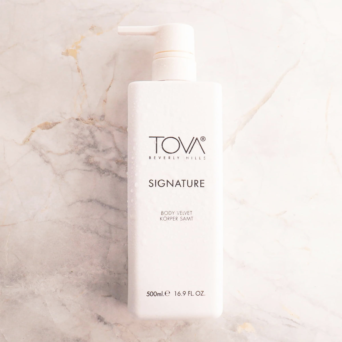 Close-up of creamy texture of Tova Velvet Lotion with botanical blend