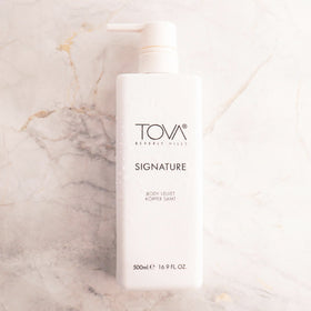 Close-up of creamy texture of Tova Velvet Lotion with botanical blend