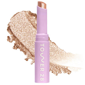 Tower 28 GoGo Cooling Shimmer Eyeshadow Stick in Troubadour with amber glow and cooling glide