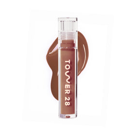 Tower 28 ShineOn Lip Gloss Jelly almond application delivering hydrating tint.