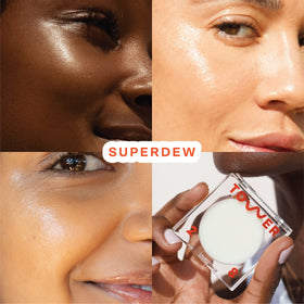 Tower 28 SuperDew Highlighter Balm clear swatch on cheekbone for a natural glow.