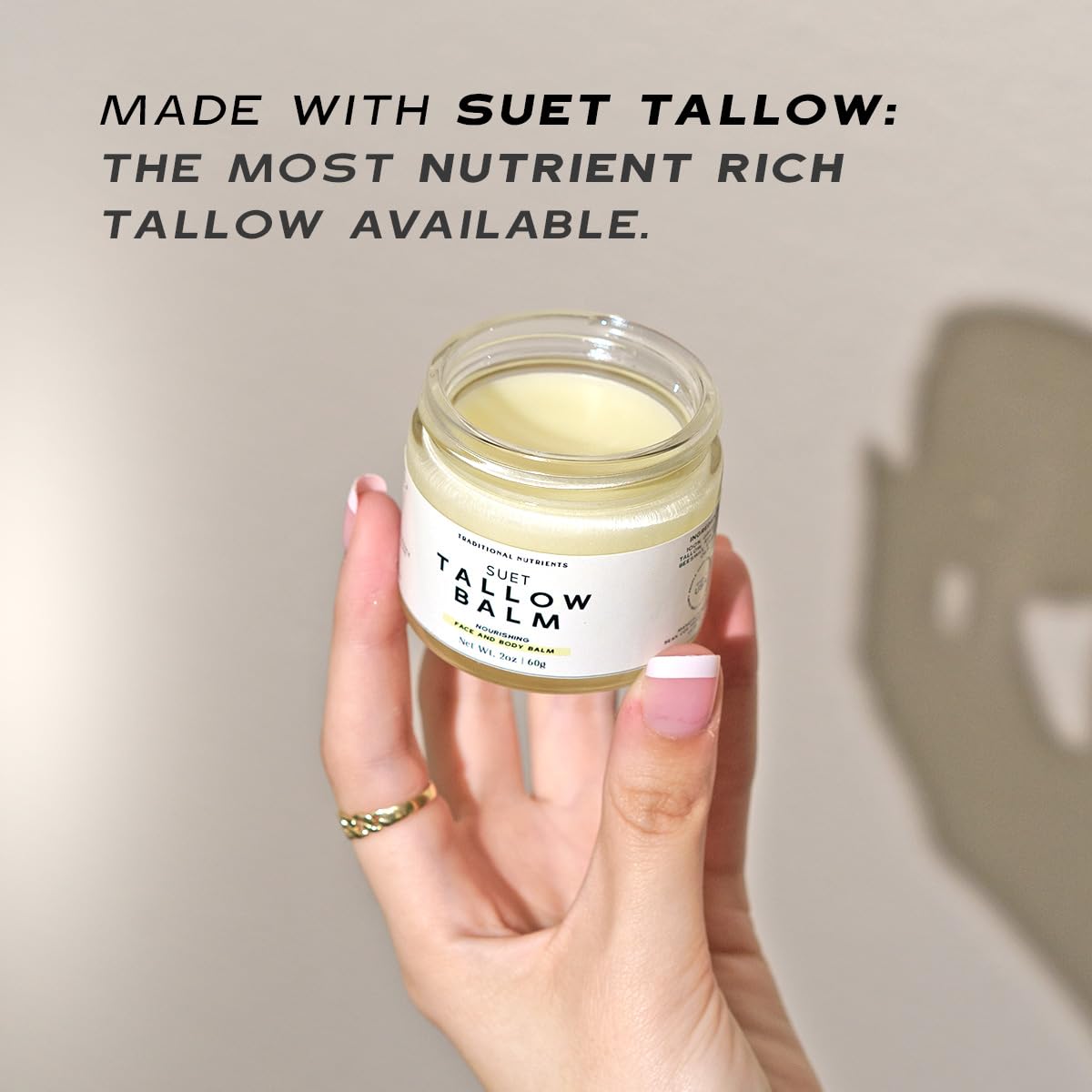 TRADITIONAL NUTRIENTS Vanilla Tallow Balm hand-application highlights easy absorption without greasy residue.