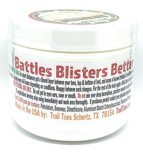 Applying Trail Toes cream on heels to protect against friction