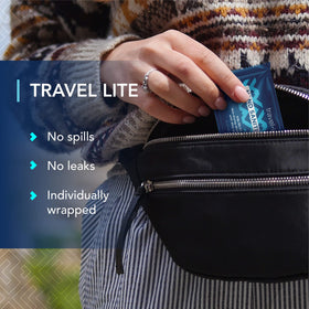 Travel Lite wipe texture close-up showing gentle moisture on skin.