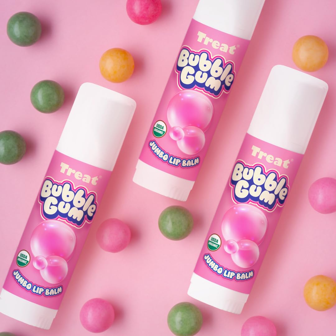 Application on lips demonstrates easy, kissable shine from Treat Jumbo Bubble Gum Lip Balm.