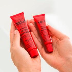Treats from Home balm in use on lips for gentle application and quick comfort.