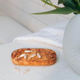 Tree of Life Beauty Vitamin C & Retinol Serum Capsules on vanity for daily routine.
