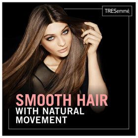 TRESemmé Keratin Smooth Shampoo lather demonstrates detangling and shine during washing.