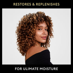Shower-time setup with shampoo and heat protection spray for styling prep.