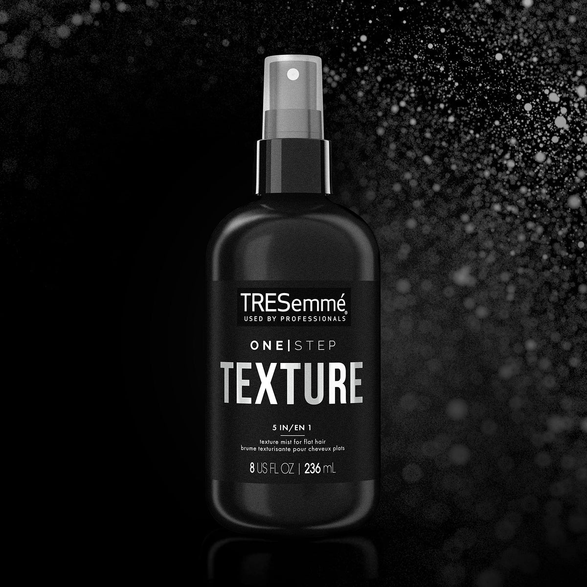 TRESemme user applying mist to dry hair for quick texture refresh