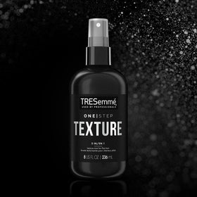TRESemme user applying mist to dry hair for quick texture refresh