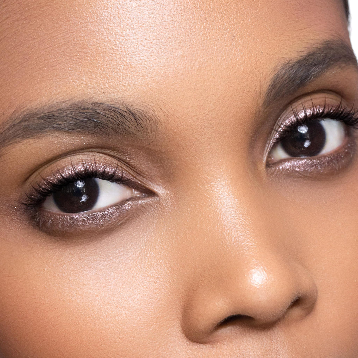 Trish McEvoy blending with brush for seamless, crease-resistant finish.