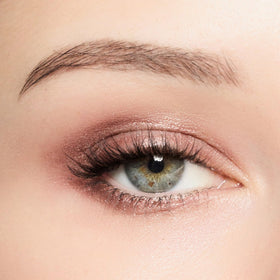 Trish McEvoy Smokey Quartz liner defined along lash line.
