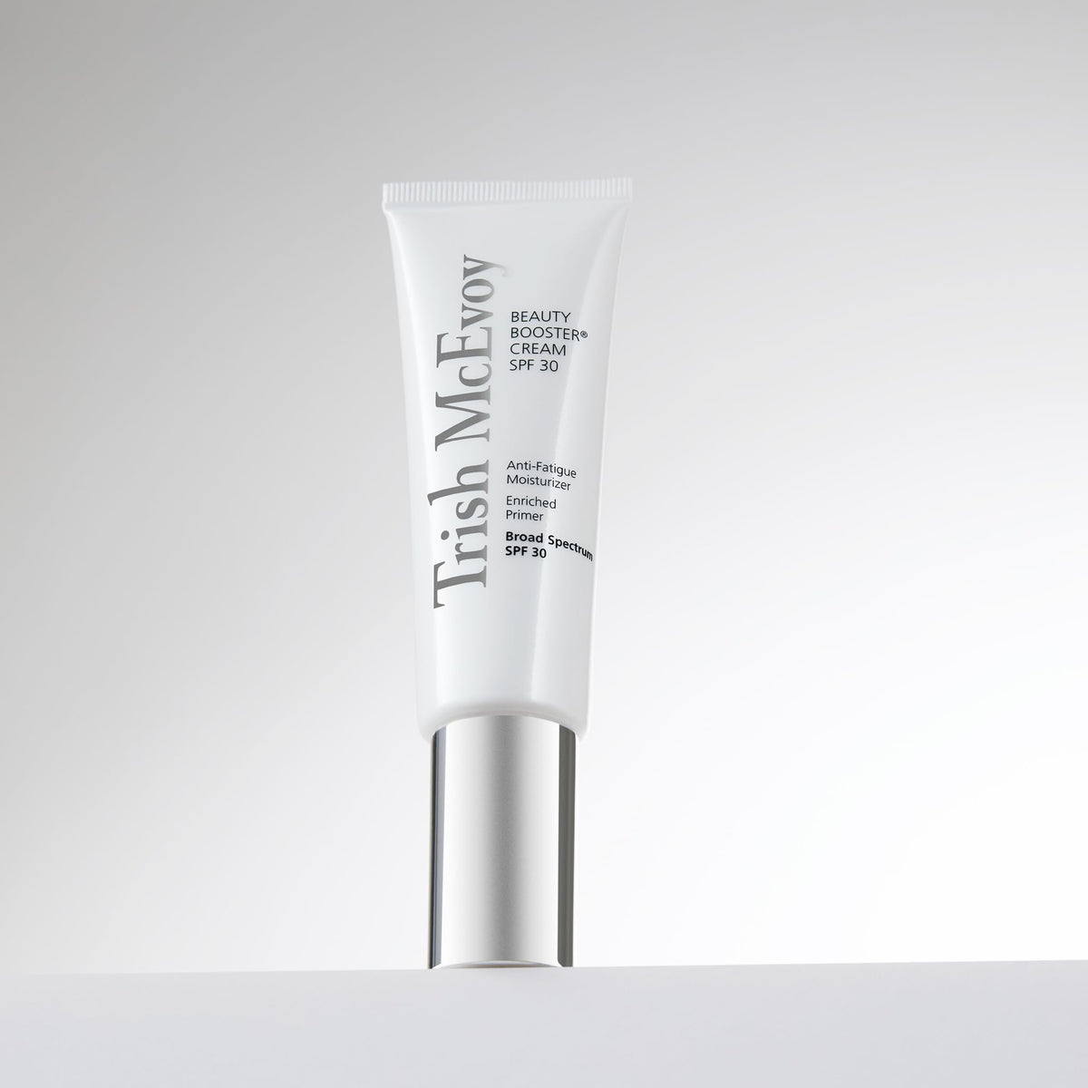 Trish McEvoy Protective Shield Beauty Booster Cream SPF 30 – fingertips applying to face for a radiant base.