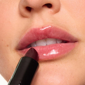 Application scene showing easy layering with primer or lip liner.