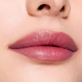 Packaging shot of Trish McEvoy Sheer Lip Color Mulberry highlighting premium design.
