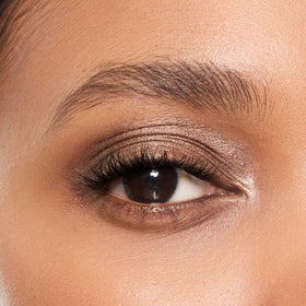 Trish McEvoy Topaz packaging and brush shown for quick on-the-go makeup.