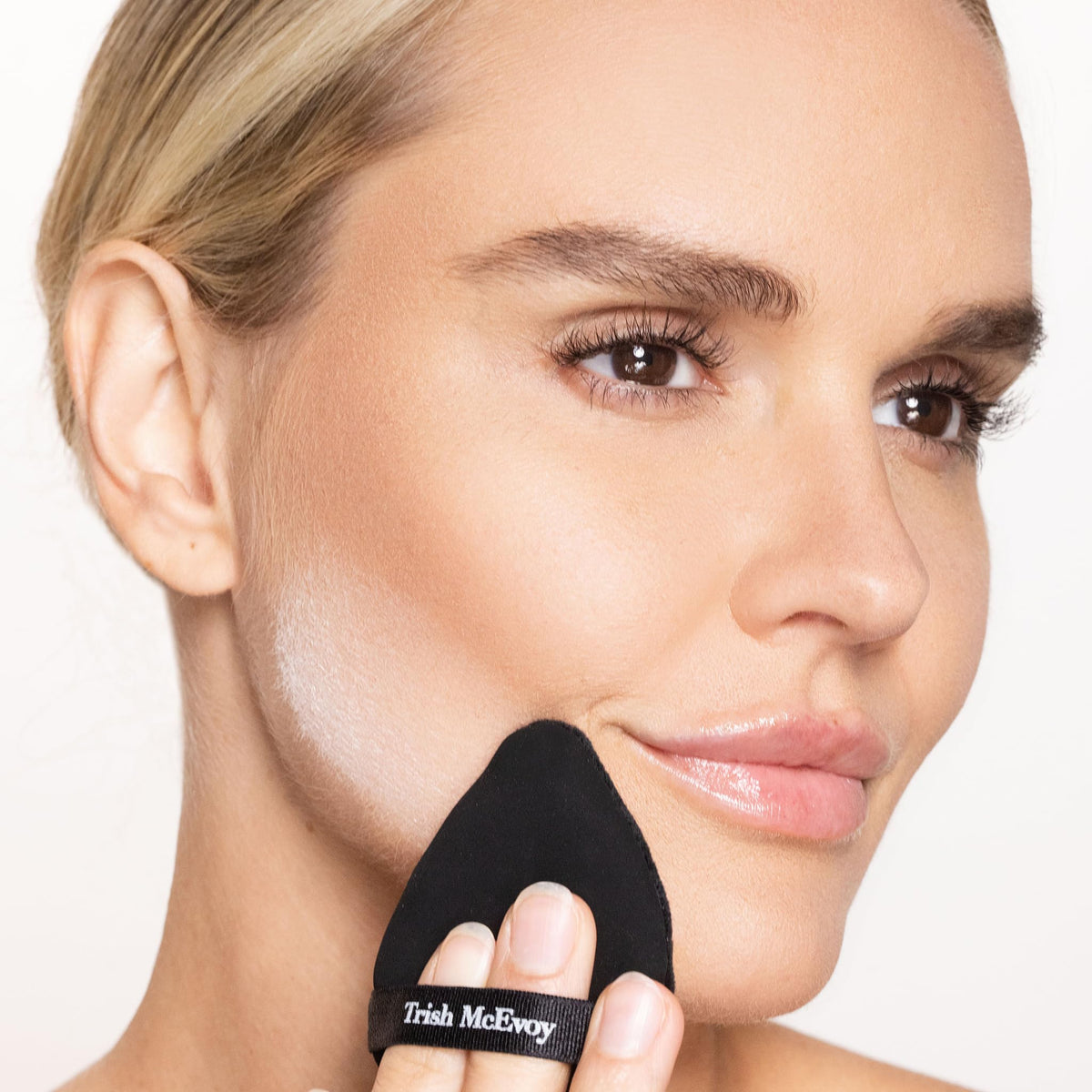 Trish McEvoy powder refill supports quick touch-ups while preserving makeup integrity.