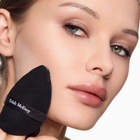 Trish McEvoy translucent finishing powder application creates a soft-focus, breathable finish.