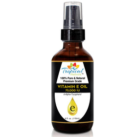 Tropical Holistic Vitamin E Oil drops applied to skin for nourishment.