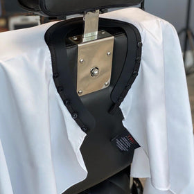 TRU BARBER cape offers generous 50 by 58 inch coverage for full neck-to-hem protection.