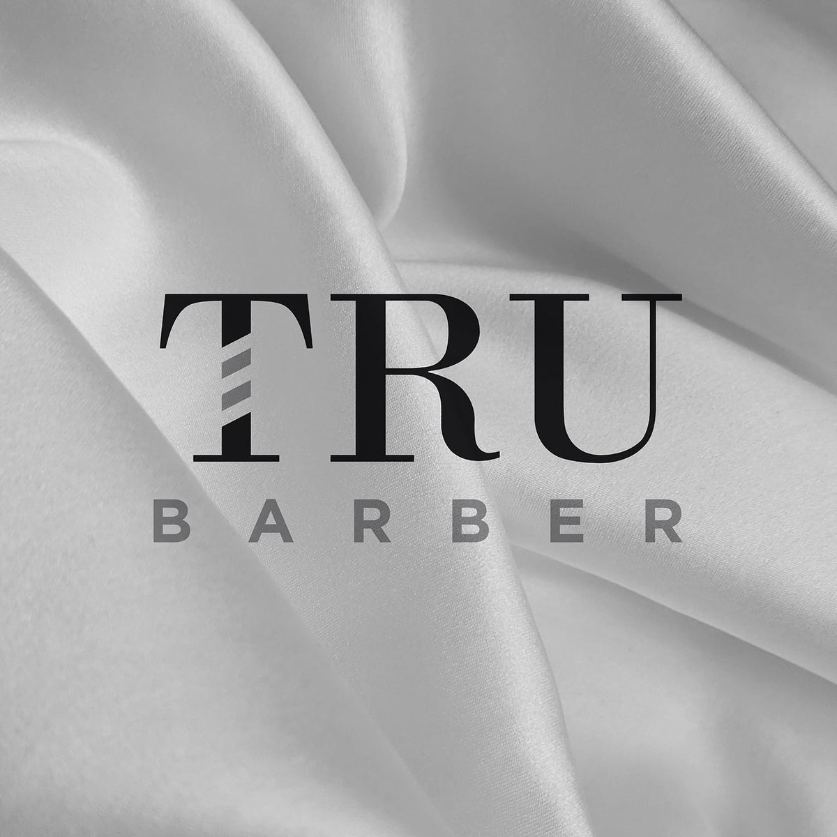 TRU BARBER professional cape designed for salon and barbershop routines.