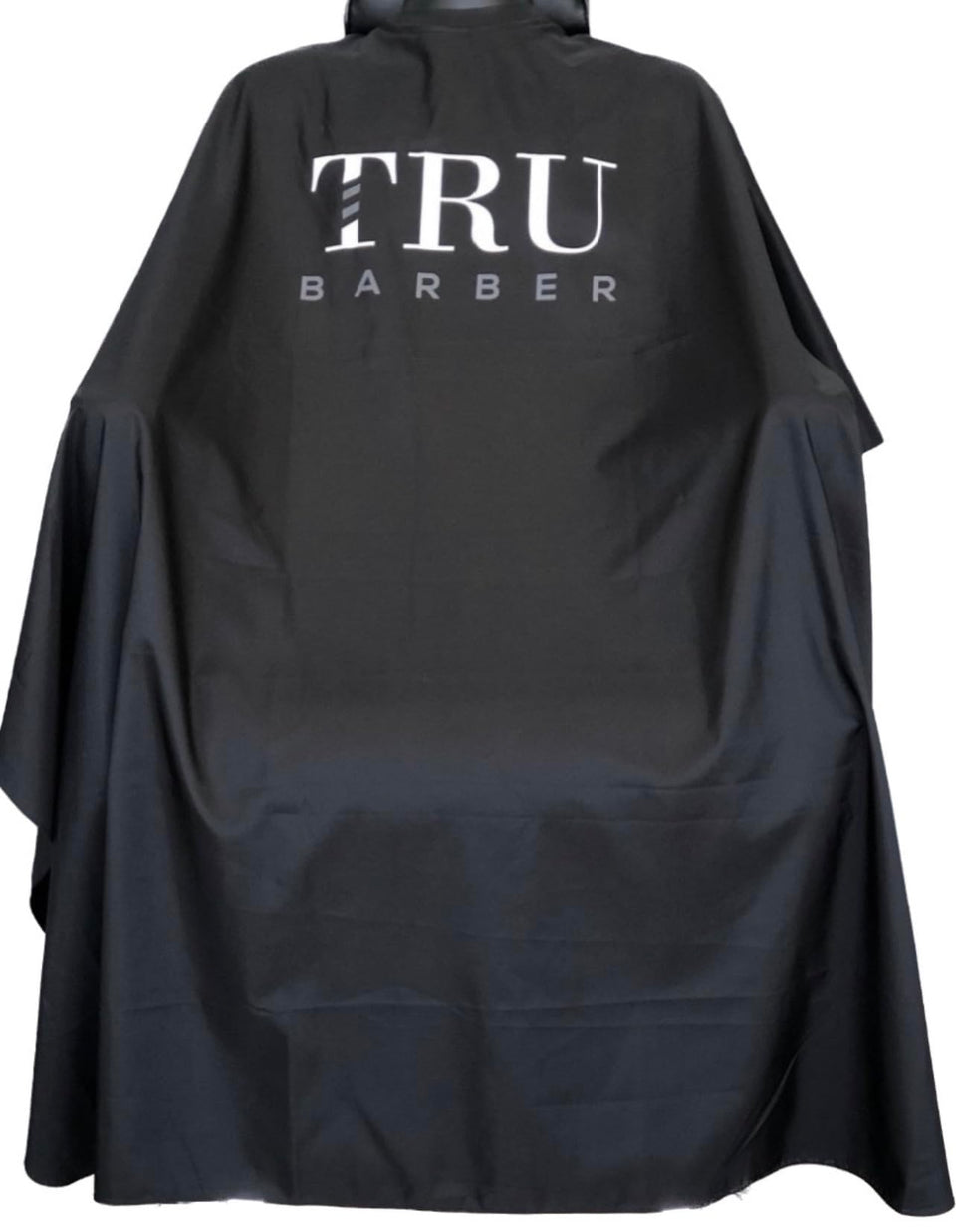 TRU BARBER silicone neck cape close-up showing comfortable neck seal and water protection