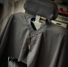 TRU BARBER cape close-up highlights lightweight, breathable polyester fabric