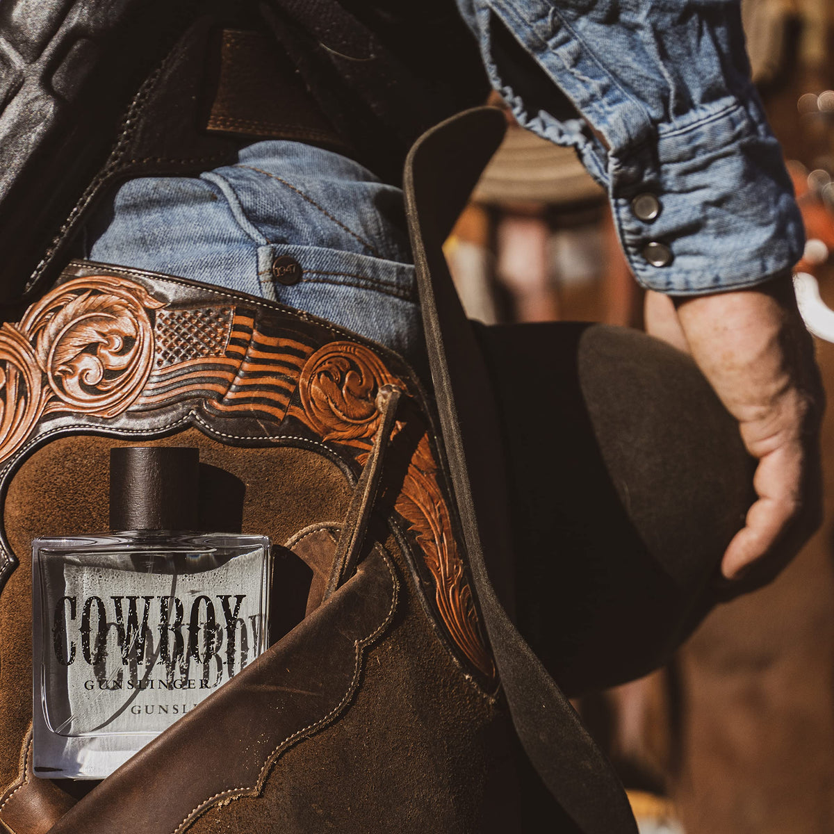 Tru Fragrance Beauty Tru Western Gunslinger bottle outdoors, rugged style.