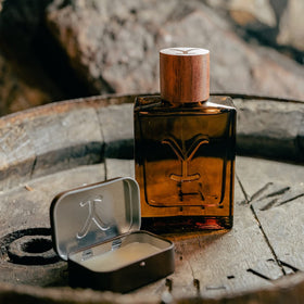 Tru Fragrance Beauty Yellowstone Ride solid cologne smoked whiskey note close-up.