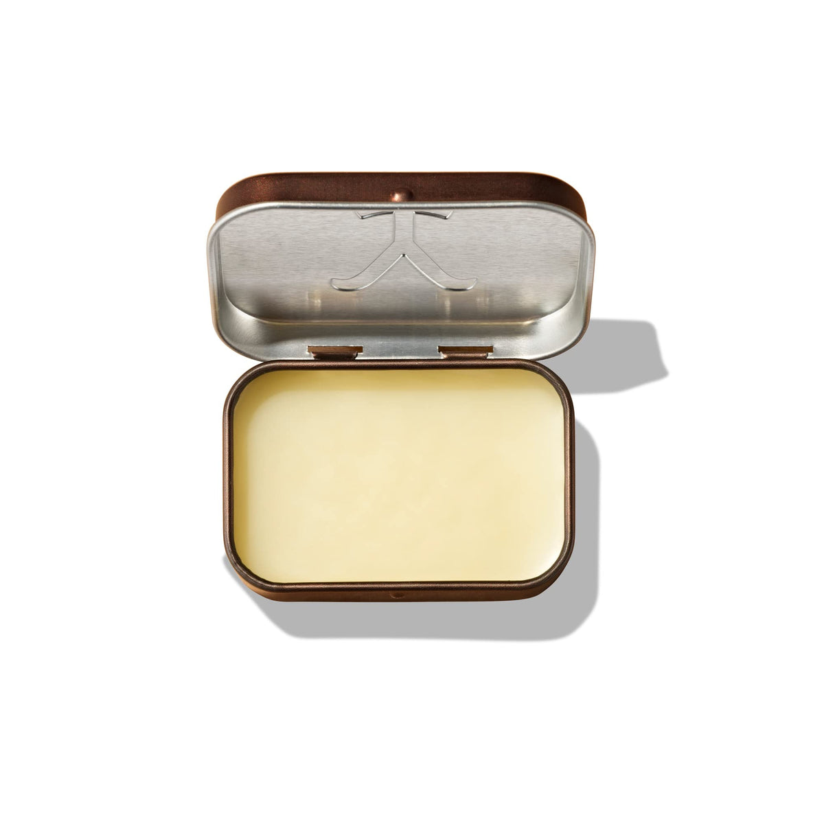 Tru Fragrance Beauty Yellowstone Ride solid cologne texture close-up shows balm-like richness.