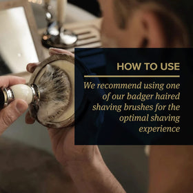 Shaving brush beside Truefitt & Hill sandalwood shaving cream bowl in ready-to-use setup