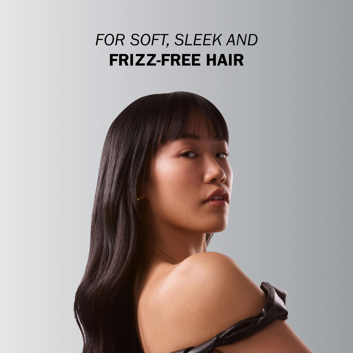 Creamy textured TRUSS Frizz Zero Conditioner ready for application.