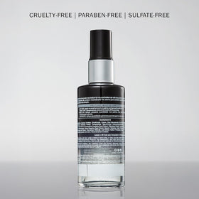 Travel-size bottle in a purse-ready setup for on-the-go care.