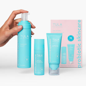 TULA Keep It Clear Cleanser foamy lather over skin.