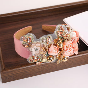 TURTLEDOVE headband with pearl accents in pink for refined ceremony wear.