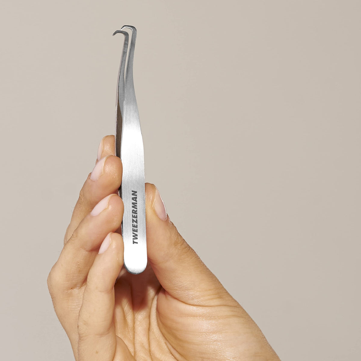 Tweezerman extractor shown for precise use and controlled pressure