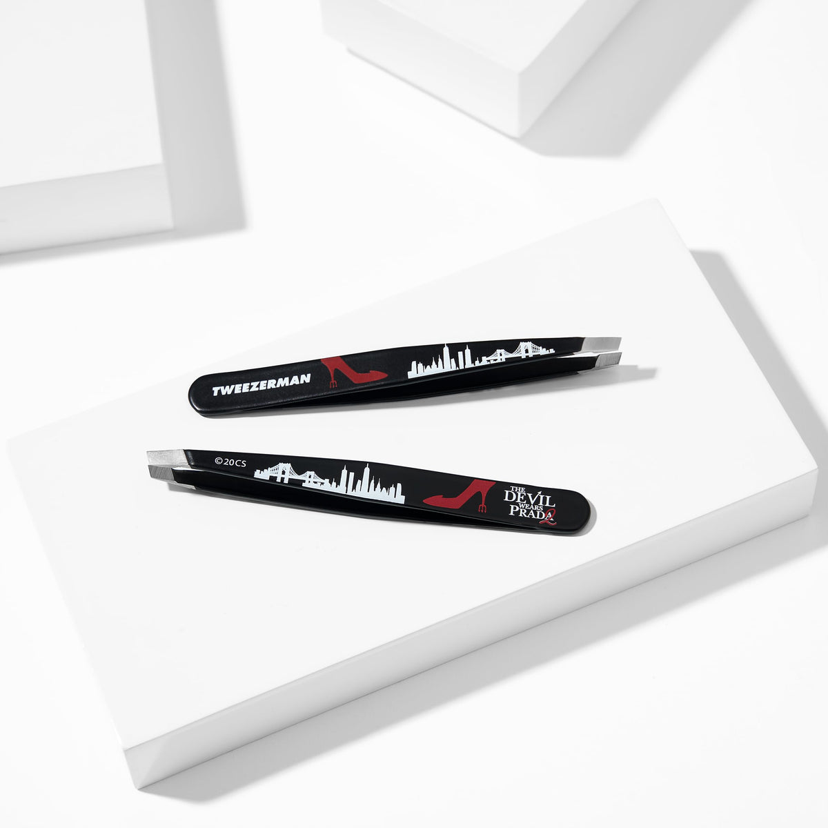 Tweezerman brow tweezer in use for precise shaping.