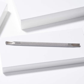 Tweezerman Cuticle Pushy curved edge cleans around and under nails.