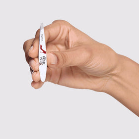 Tweezerman Devil Wears Prada 2 Mini Slant Tweezer in hand for controlled brow shaping