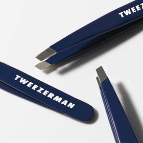 Tweezerman Evening Blue Mini Slant Tweezer in travel case for on the go touch ups.