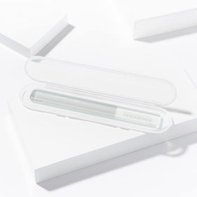 Tweezerman Glass Nail Buffer polishing nails with a high shine finish.