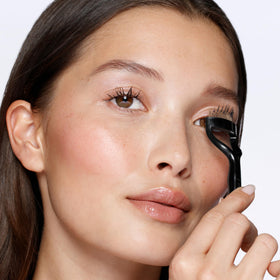 Tweezerman lash comb with gold-plated teeth for precise separation and even mascara.