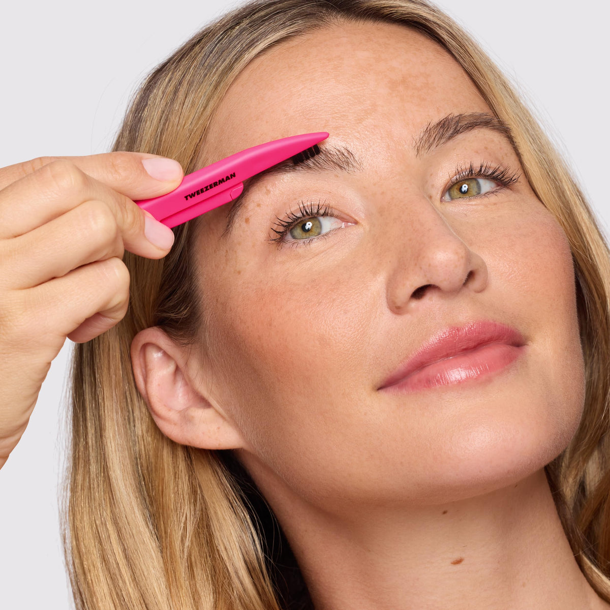 Tweezerman mini angled brow brush for natural-looking brow fill