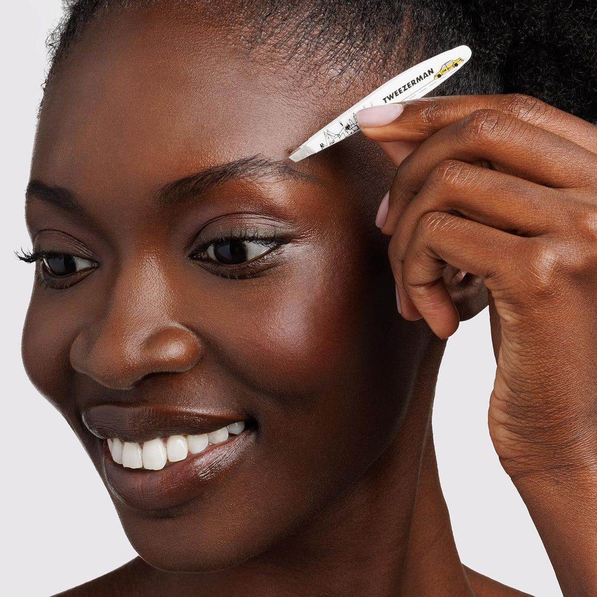 Tweezerman NYC Mini Slant Tweezer, travel-friendly design for on-the-go grooming.