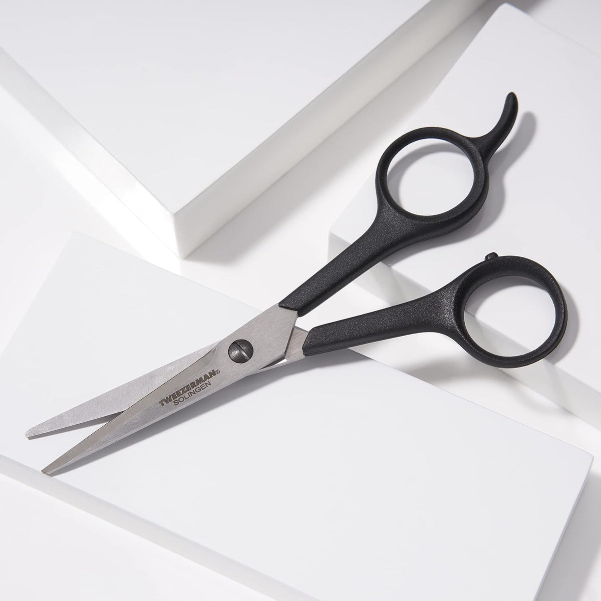 Tweezerman Spirit 2000 micro-serrated edge shown for controlled trimming.