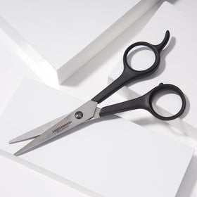Tweezerman Spirit 2000 micro-serrated edge shown for controlled trimming.